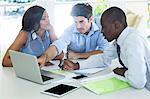 Couple and real estate agent discussing together