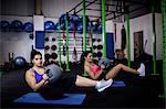 Women exercising with a medicine ball