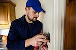 Electrician fixing a door bell