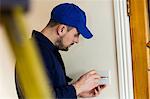 Electrician fixing a door bell