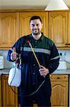 Portrait of pest control man spraying pesticide