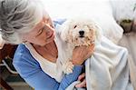 Senior woman holding a dog