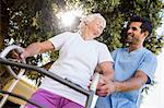 Nurse helping senior woman to walk