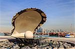 Pearl Monument with moored dhows and modern city skyline of West Bay, from Al-Corniche, Doha, Qatar, Middle East