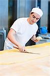 Baker preparing dough