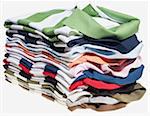 Stack of striped polo shirts on white background