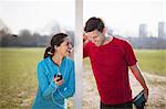 Young woman and man warm up training on playing field