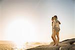 Two mid adult women looking out beach, Cape Town, South Africa