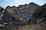 Hiker exploring Chasm Lake, Rocky Mountains National Park, Colorado