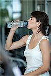 Woman drinking water after a workout