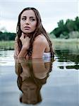 USA, Utah, Provo, woman standing in lake and shivering