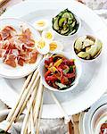 Overhead view of antipasto platter on white tray