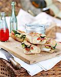 Vegetable pan bagna on cutting board and picnic basket