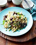 High angle view of mushroom and celery salad on blue plate