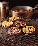 Chocolate coated florentine biscuits on cooling rack