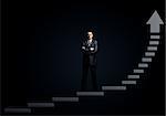 Businessman standing on stairs