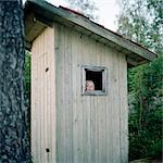 Girl in outhouse