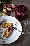 Rusks with jam on plate, high angle view