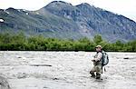 Man fishing in mountain lake