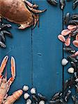 Seafood against blue wooden background