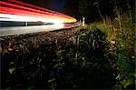 Roadside with light streaks from cars