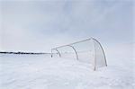 Hockey net in snow-covered field