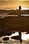 Woman standing on rock formations