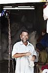 Smiling man shopping in outdoor market