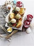 Plate of cheeseburgers with soda