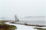 Snowy road in rural landscape