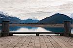 Wooden dock on still rural lake