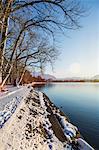 Snowy bank and still rural lake