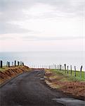 Paved road on rural cliff