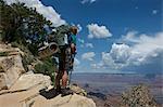 Man standing on rocks, New Hance, Grandview Hike, Grand Canyon, Arizona, USA
