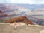 Girl walking away from canyon edge