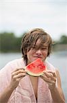 Portrait of boy eating a slice of water melon