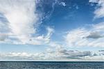 Sea and blue sky with clouds