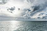 Grey sea and clouds with sunlight