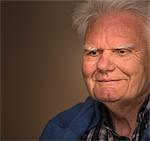 Close up portrait of smiling senior man