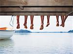 Children sitting on edge of jetty