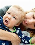 Mother holding crying boy