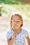 Girl smelling lily of the valley