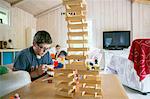 Boy playing with wooden blocks
