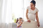 Mother and daughter building cot