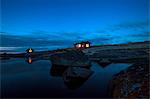 Wooden houses on rocky coast