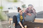 Young couple relaxing in apartment bedroom