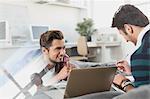 Male college students studying with laptop