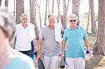 Senior men after yoga class in park