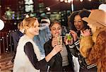 Young women drinking and enjoying rooftop party