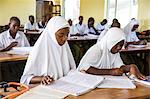 Children studying during a class taken by VSO volunteer Paul Jennings and local teacher Rebecca Ngovano, Angaza school, Lindi, Tanzania, East Africa, Africa